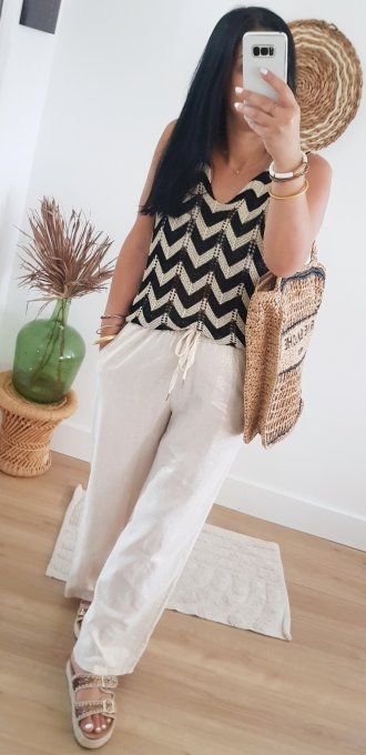 Pull sans manches ziz zag lurex jusqu'au 42.Taille unique 