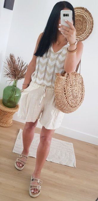 Pull sans manches ziz zag lurex jusqu'au 42.Taille unique 