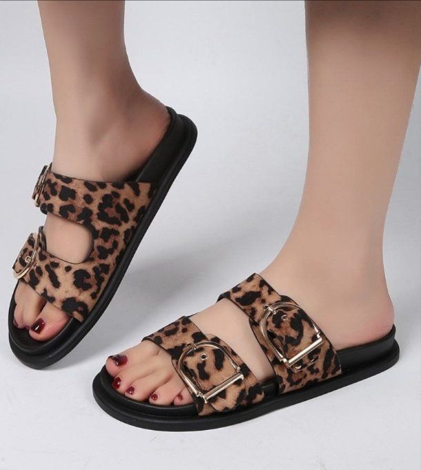 Mules imprimé animal boucles D et semelle noire